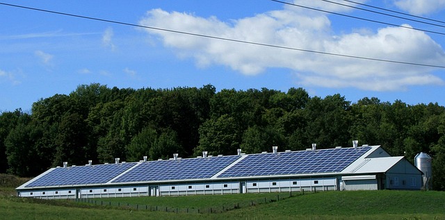 commercial solar panels on a warehouse roof in Dublin with skyline in background